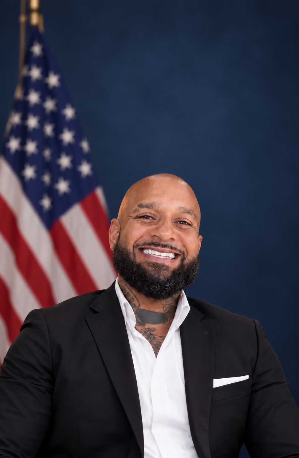 Portrait of Romeo Toro with an American flag